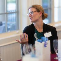 Kelly Machnik talking with peers